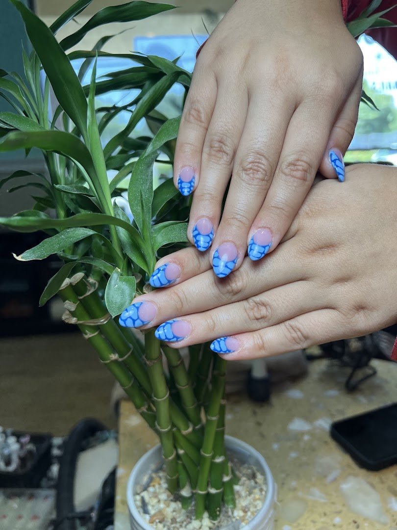 Nail technician working on a client’s nails.