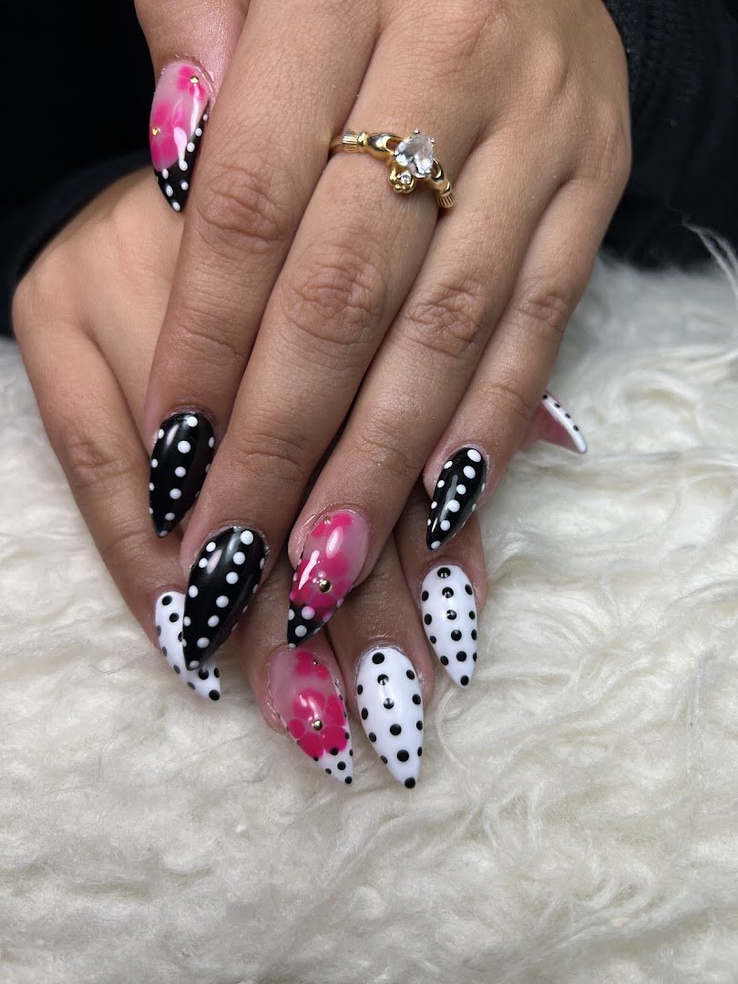 Nail technician working on a client’s nails.